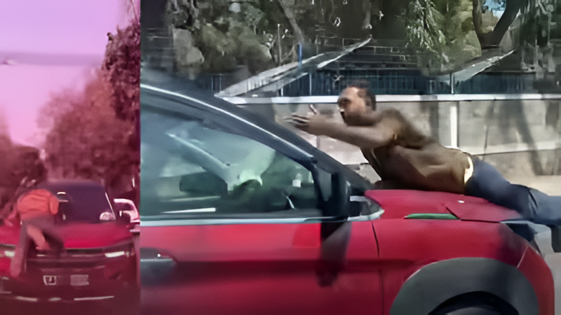 ಡೆಡ್ಲಿ ರೋಡ್ ರೇಜ್ – ಪೊಲೀಸ್ ಬಾನೆಟ್ ಮೇಲೆ ನೇತಾಡಿ ಕಾರು ಚಾಲಕ ಪರಾರಿಯಾಗಲು ಯತ್ನ.